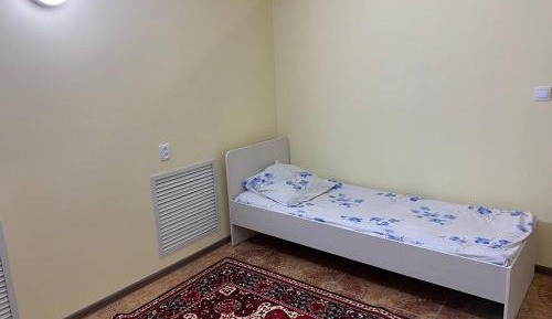 Single Bed in Dormitory Room