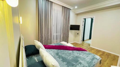 Shymkent Apartment | ЖК Capital City евродвушка апартамент, светлая и уютная, рядом с ТРЦ Shymkent Mall и парком с музыкальным фонтаном Shymkent City
